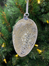 Load image into Gallery viewer, Silver glass egg decoration with silver treasure embellishments.
