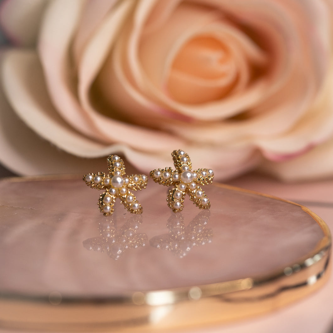 Pearl embellished gold starfish stud earrings